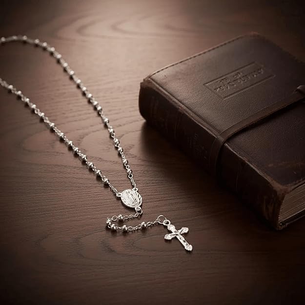 silver-plated rosary necklace featuring smooth 3 mm (0.12 inch) prayer beads, a finely detailed crucifix pendant measuring 1.3 cm (0.51 inch), and a classic Catholic design perfect for daily wear or devotional prayer.
