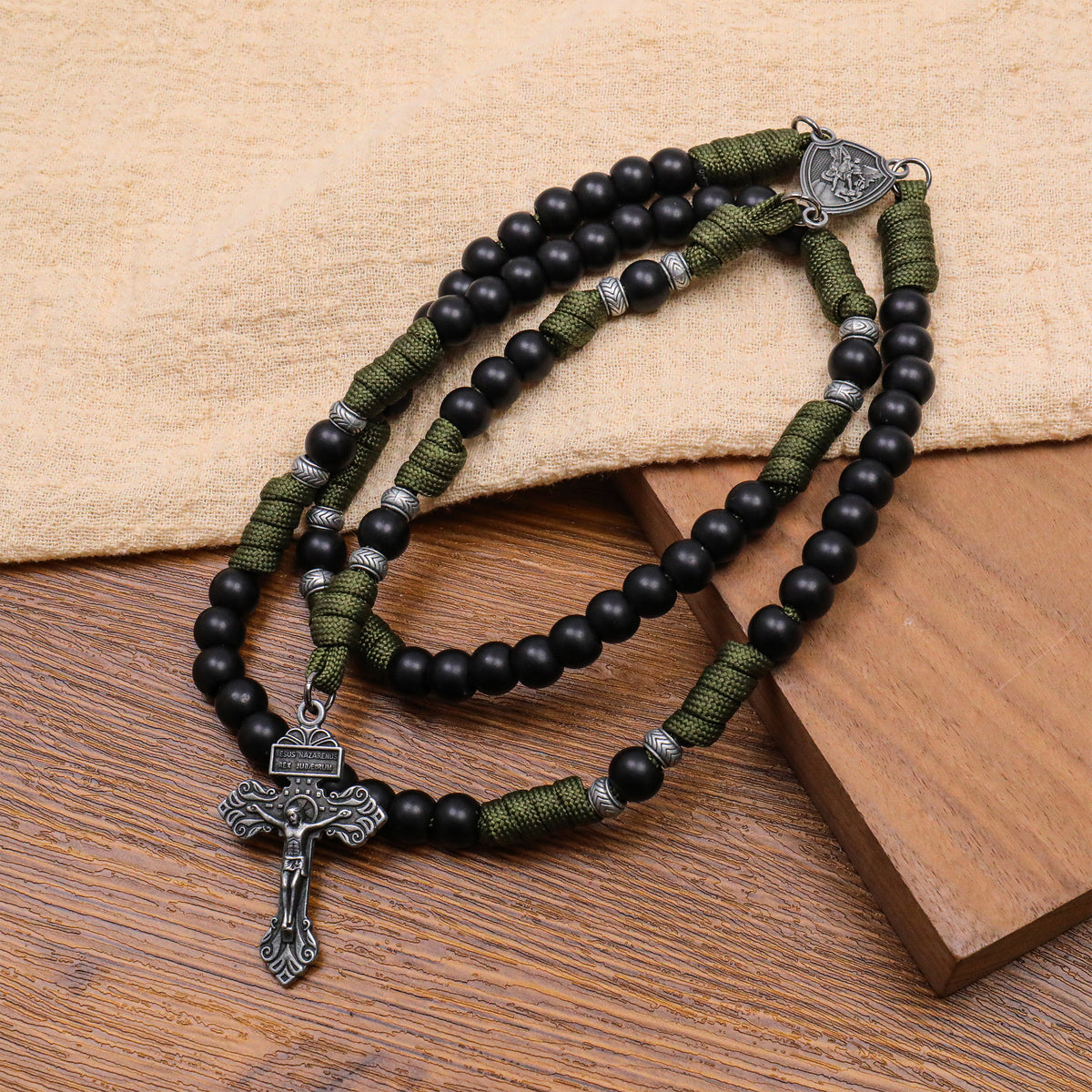 Men's Black Beaded Antique Olive Green Paracord Rosary Necklace with Silver St. Michael Medal & Pardon Crucifix
ASIN: B0HJWH5QKT