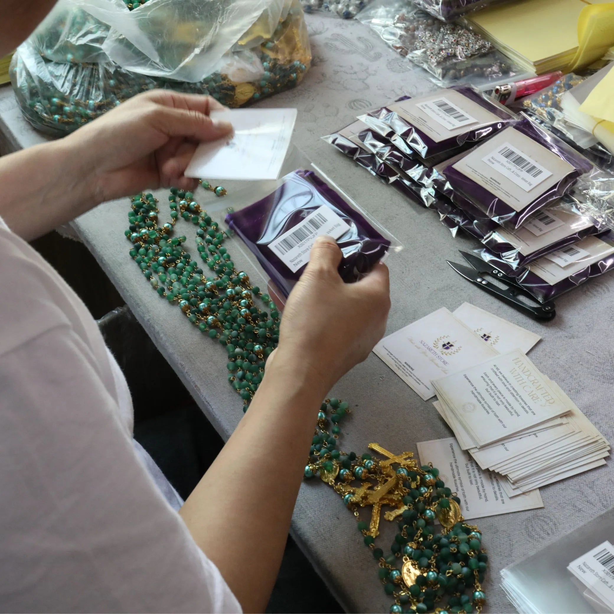 Nazareth Store rosaries being prepared with care