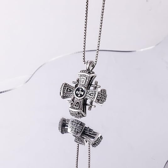This Black Enamel Jerusalem Cross Necklace is a striking and meaningful piece, blending deep black enamel with a sophisticated antique silver-plated finish.