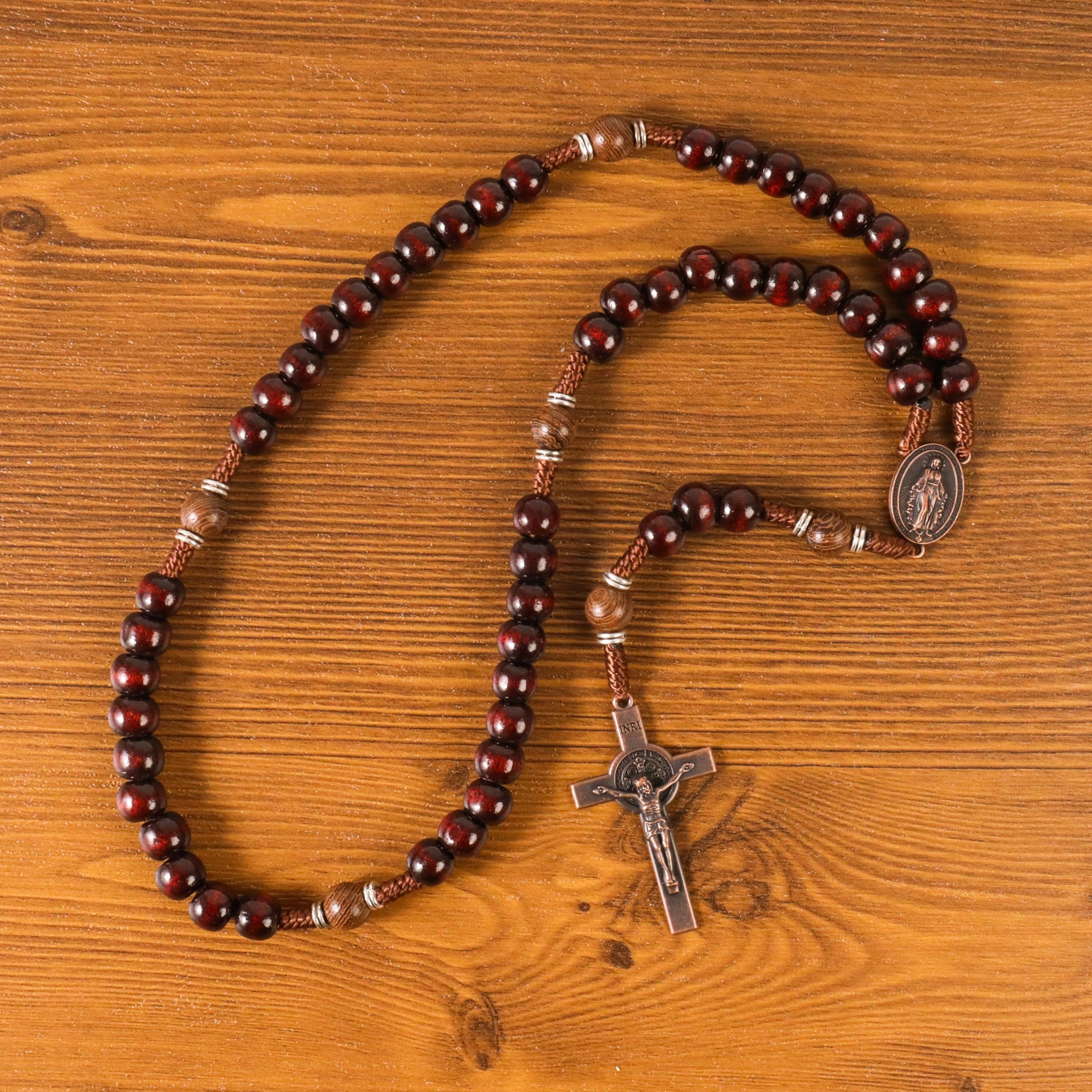 Crafted with 10mm dark red and 10mm Olive wood mystery beads, this rosary offers a bold, strong design that’s perfect for men. The natural wood grains and deep colors enhance the rosary’s powerful, masculine presence.