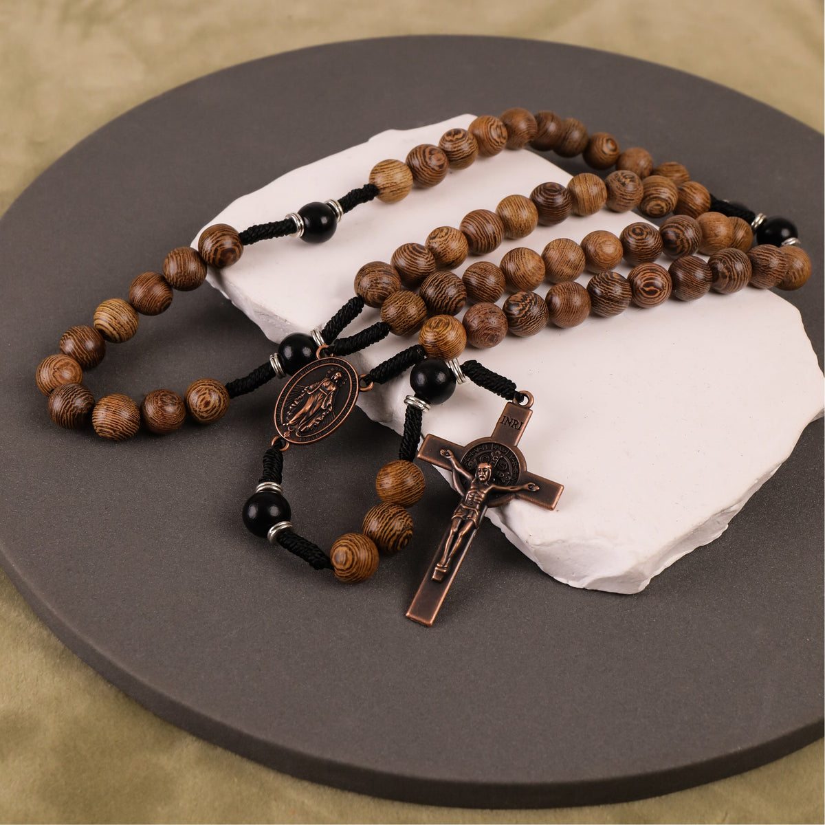 10mm olive and 10mm black wood mystery beads, this rosary offers a bold, strong design that’s perfect for men.