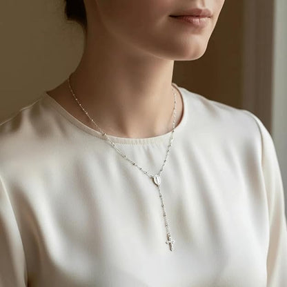 silver-plated rosary necklace featuring smooth 3 mm (0.12 inch) prayer beads, a finely detailed crucifix pendant measuring 1.3 cm (0.51 inch), and a classic Catholic design perfect for daily wear or devotional prayer.