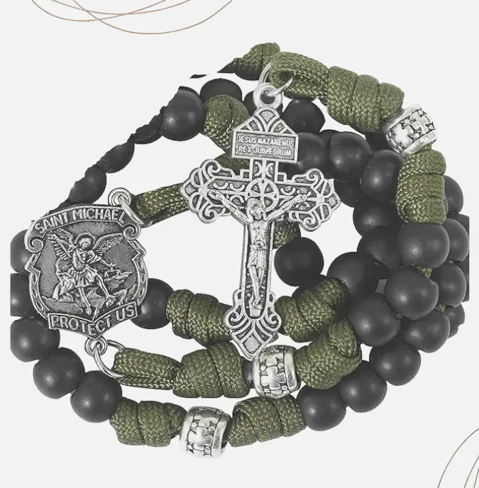 Paracord Rosary with black and green beads and Saint michael medal a white background